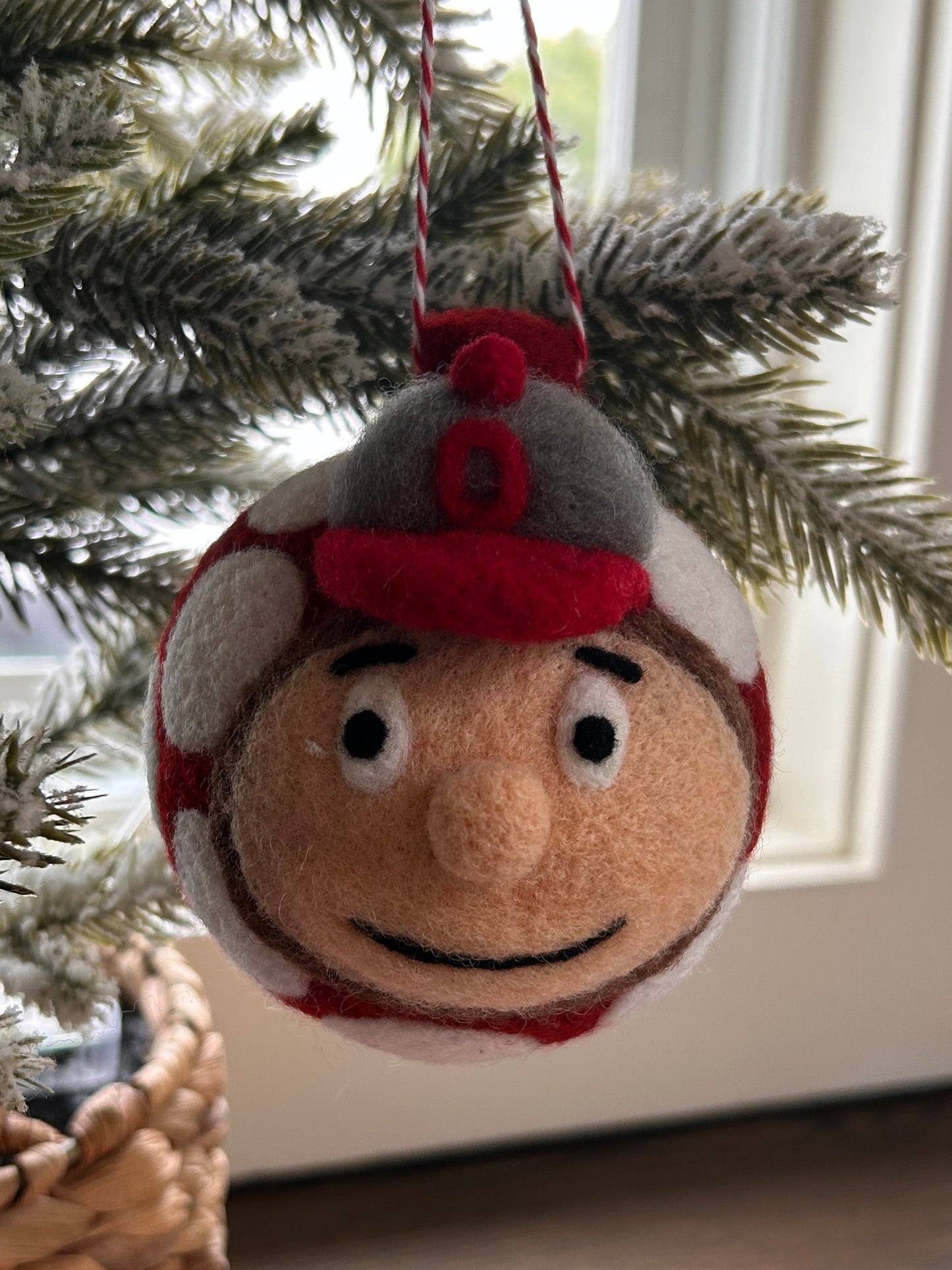 Brutus face on scarlet with white dots