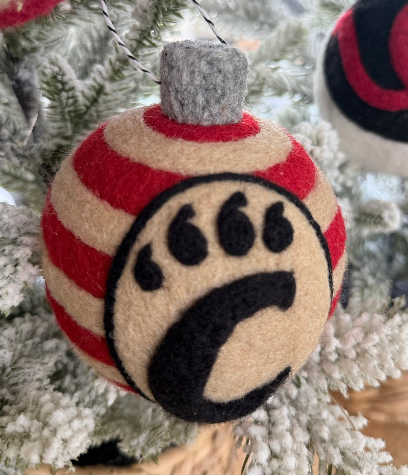 UC striped ornamnet with the UC monogram