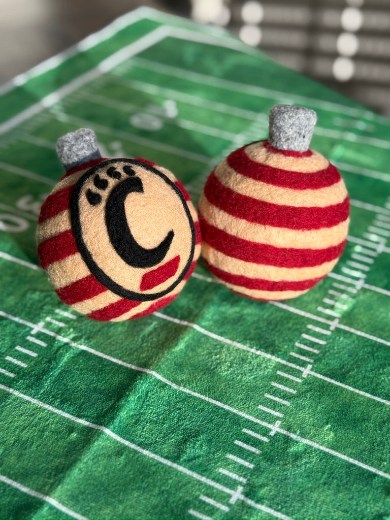 UC striped ornamnet with the UC monogram